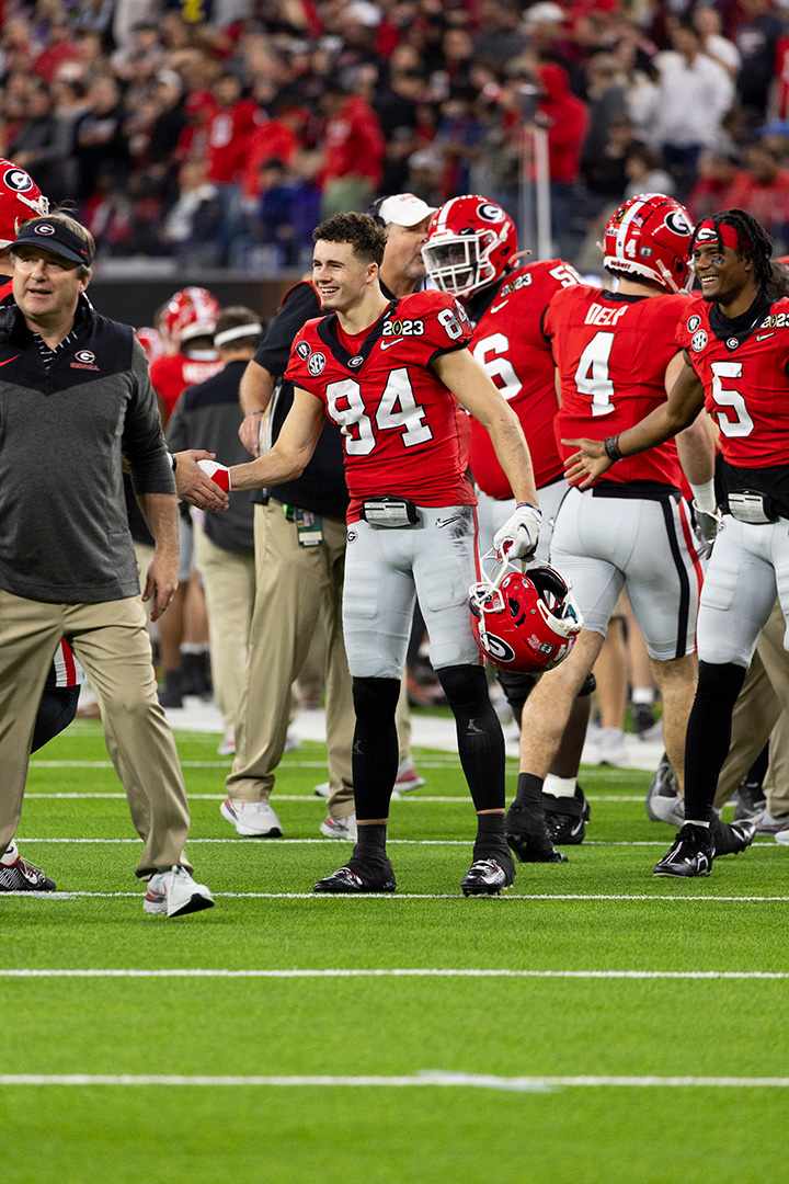 Ladd McCockney and Kirby Smart celebrating a good play