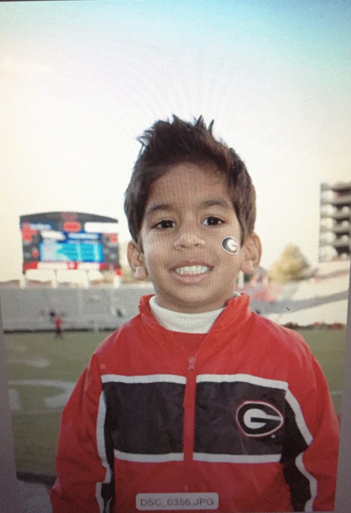 A young Jayan Patel on the field at Sanford Stadium