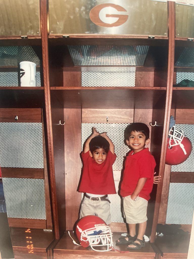 A young Jayan Patel and his brother in the Bulldog's locker room