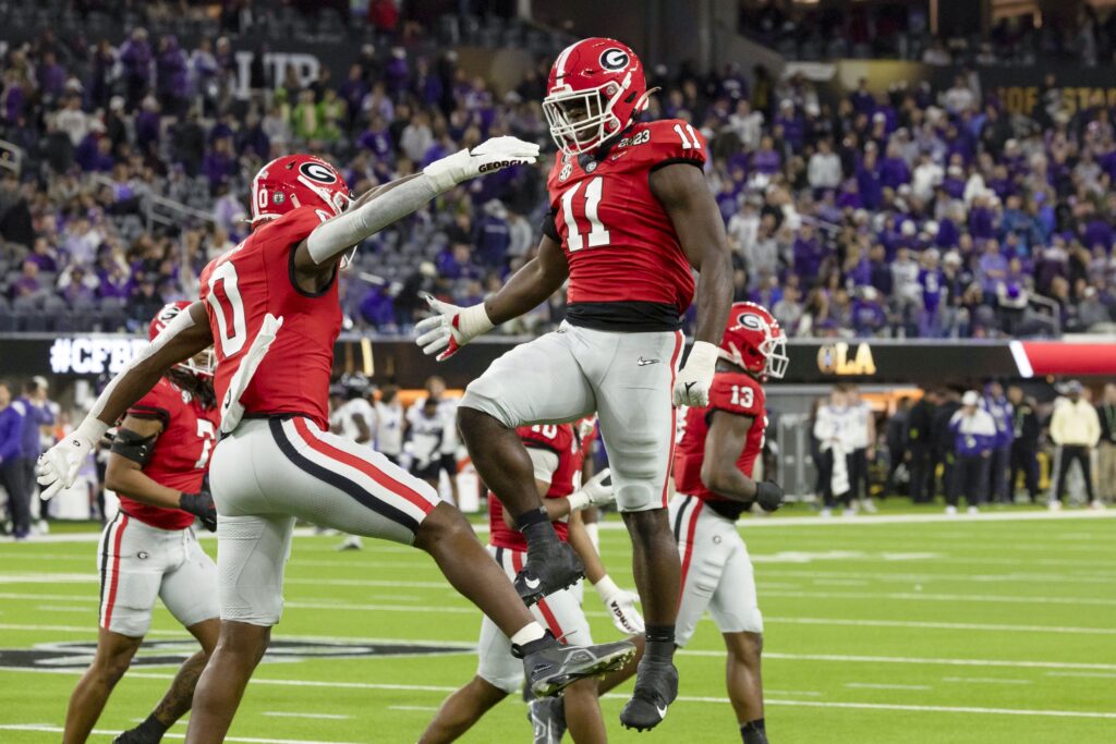 Jalon Walker celebrates with a teammate during a UGA football game.