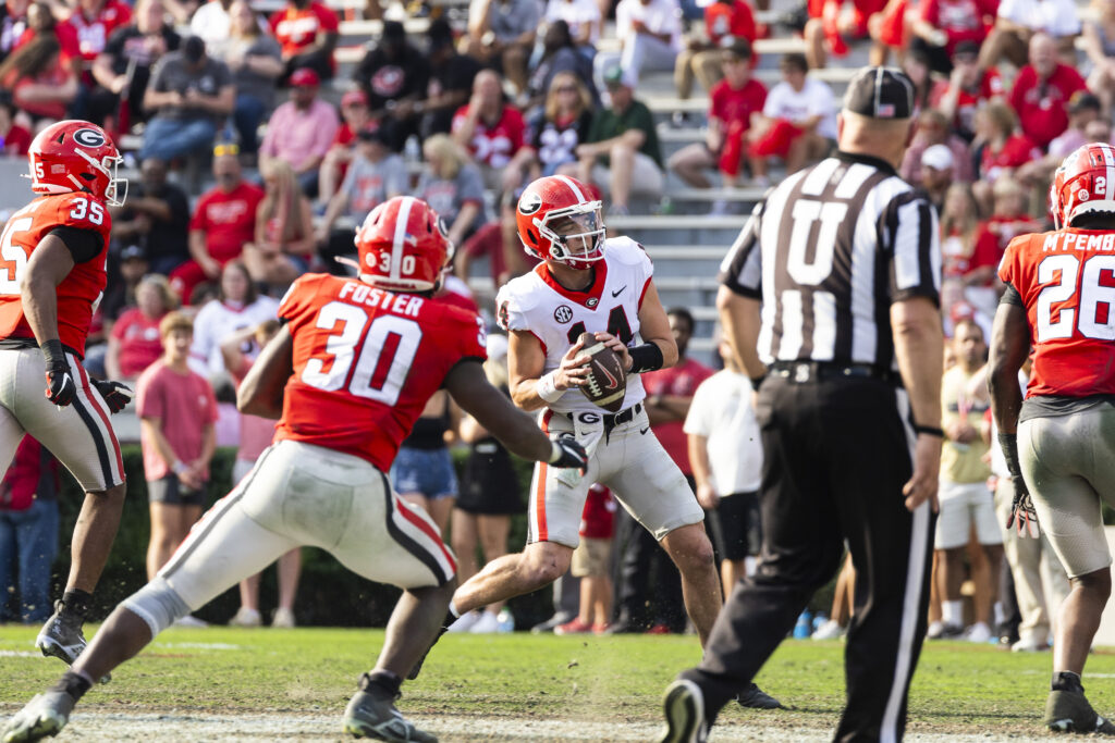 Quarterback Gunner Stockton (14) rolls out to pass during the 2023 G-Day Spring Football Game.