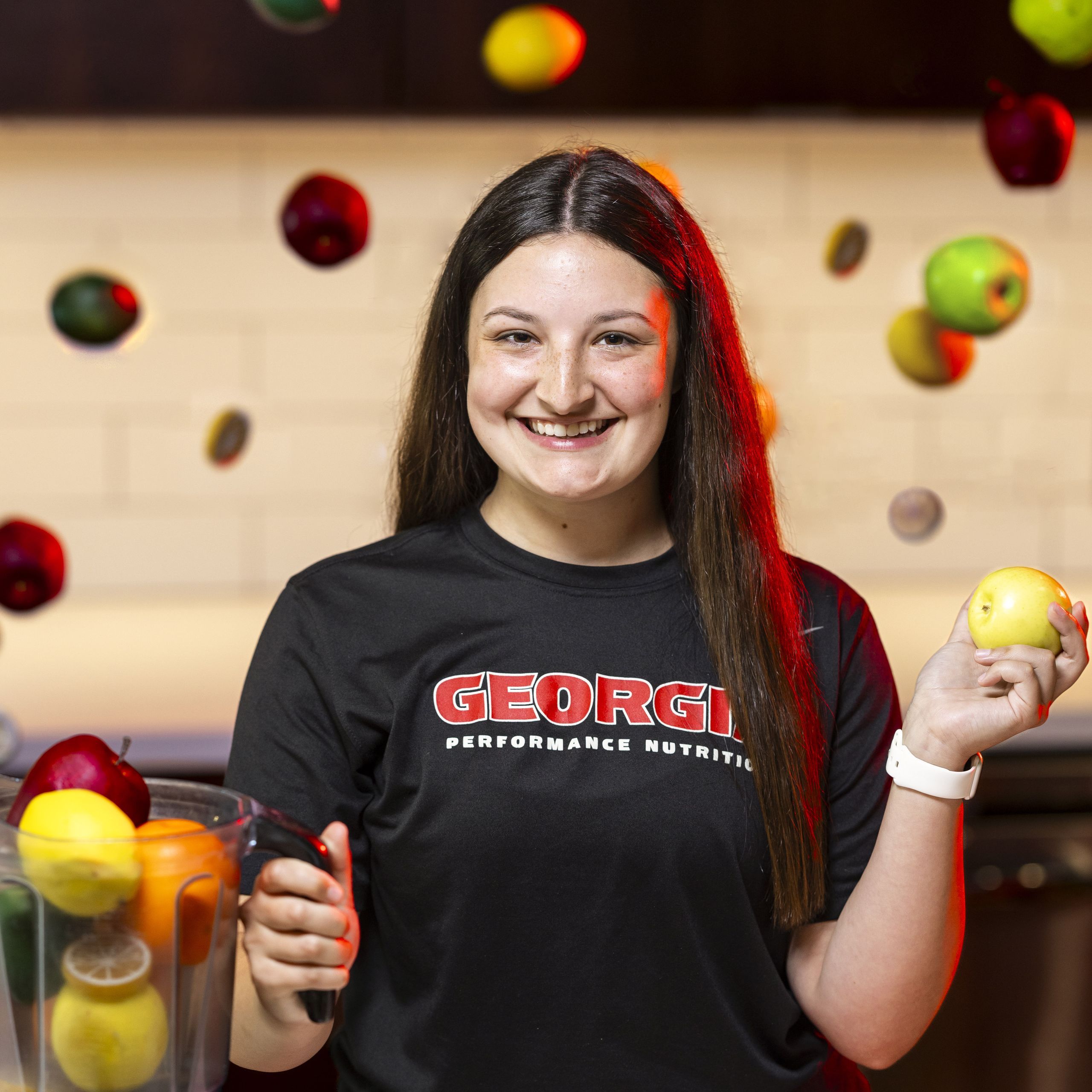 Portrait of Avery Karp, sports nutrition student worker, at the smoothie bar in the football facility.