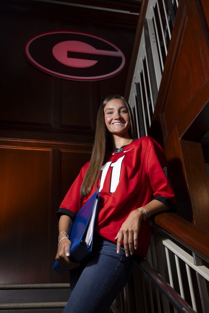 Portrait of athletics tutor, senior Halle Bynum in a stairwell at the Rankin Smith Student Athlete Academic Center.