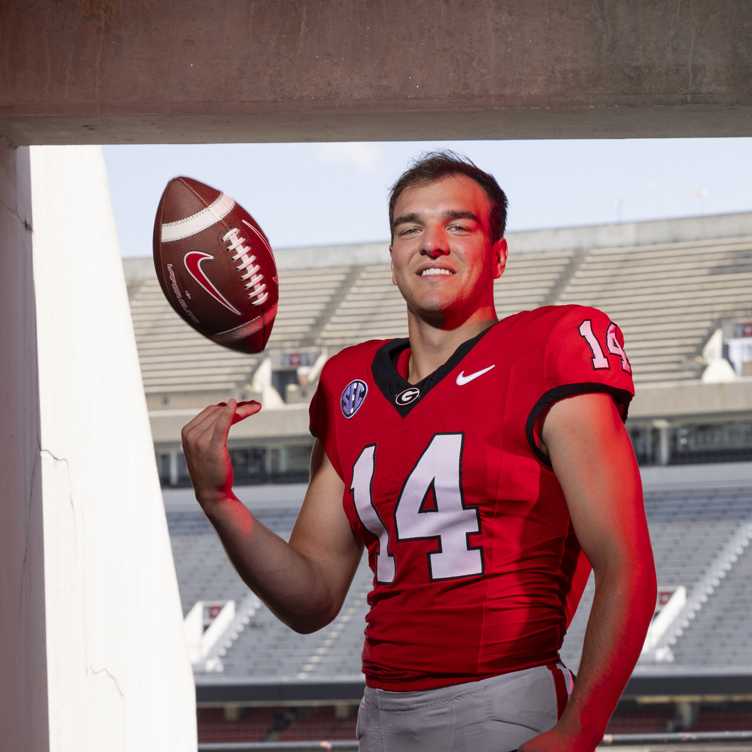 Portrait of red shirt sophomore quarterback Gunner Stockton in a tunnel at Sanford Stadium.