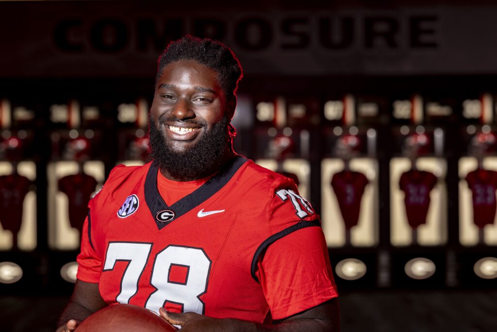 Portrait of undergraduate football team member Nazir Stackhouse in the locker room at Sanford Stadium.