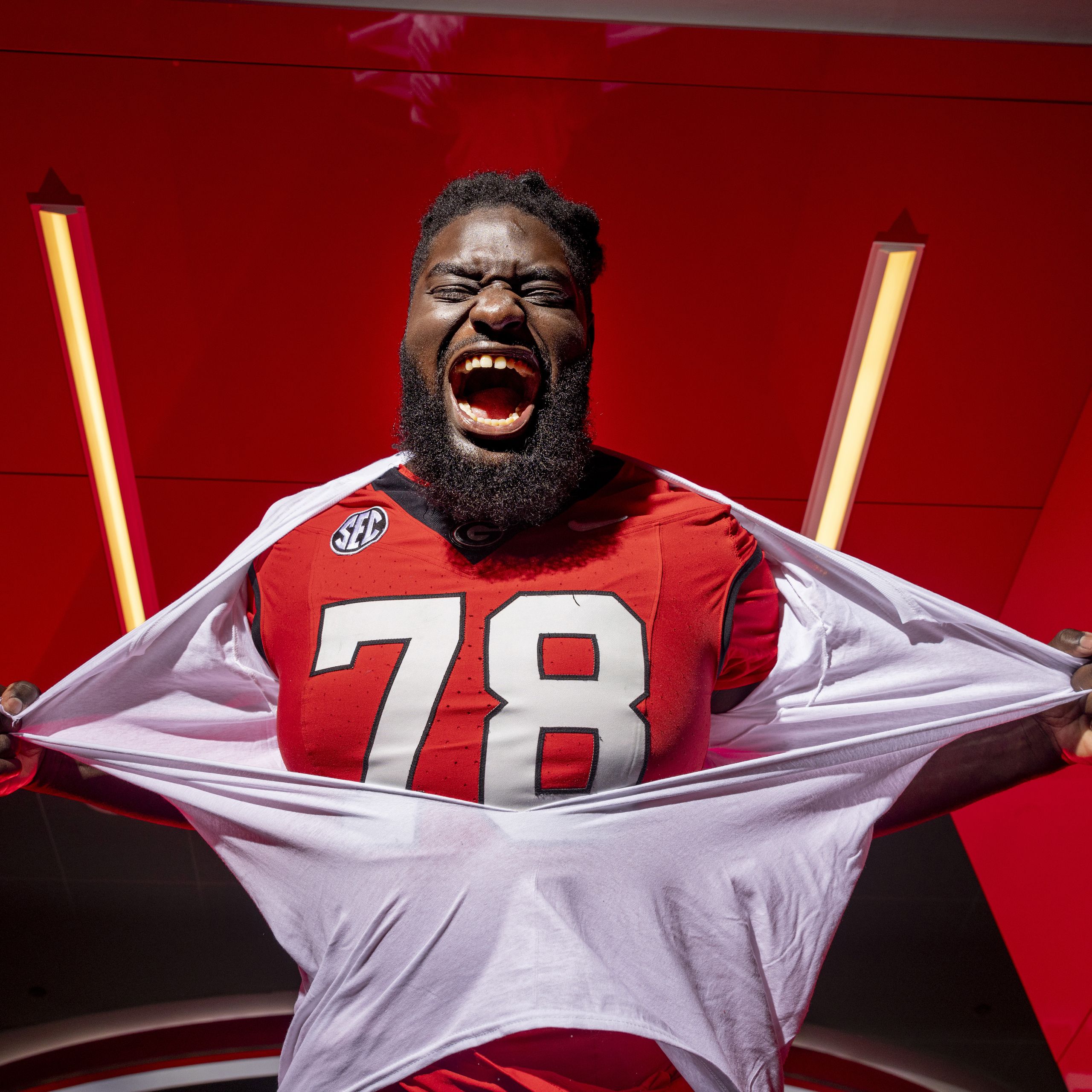 Portrait of undergraduate football team member Nazir Stackhouse in the locker room at Sanford Stadium.