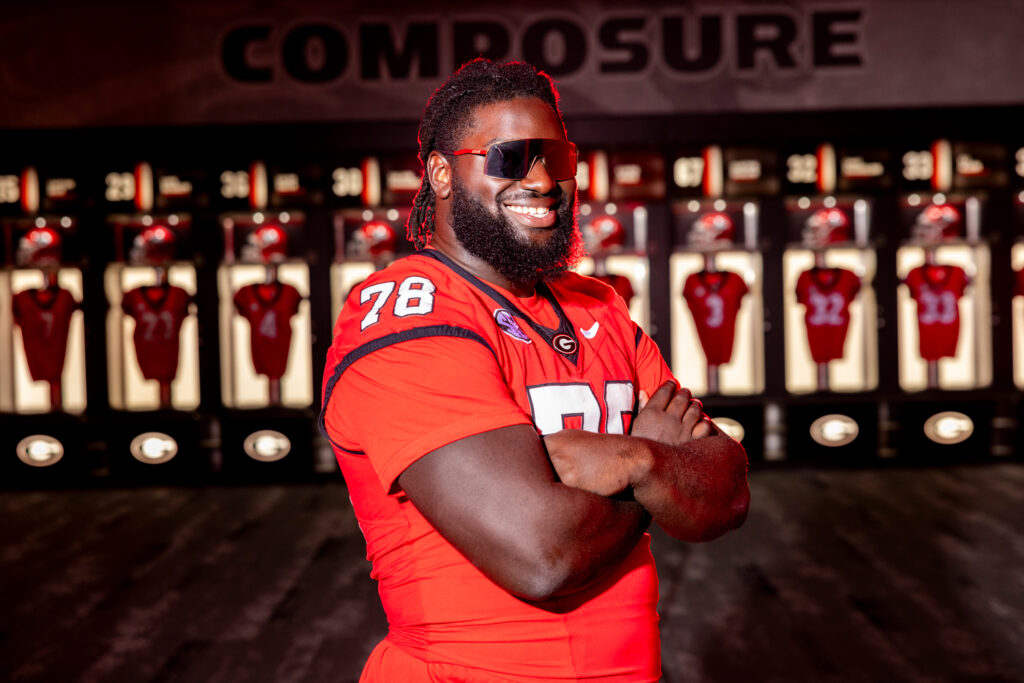 Portrait of undergraduate football team member Nazir Stackhouse in the locker room at Sanford Stadium.